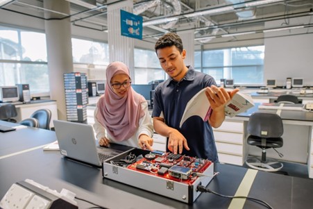 students conducting experiments on IOT kits.jpg